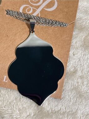 Plunder silver tone pendant necklace